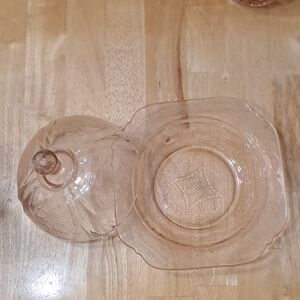 This is a pink depression glass covered butter dish in the Madrid pattern